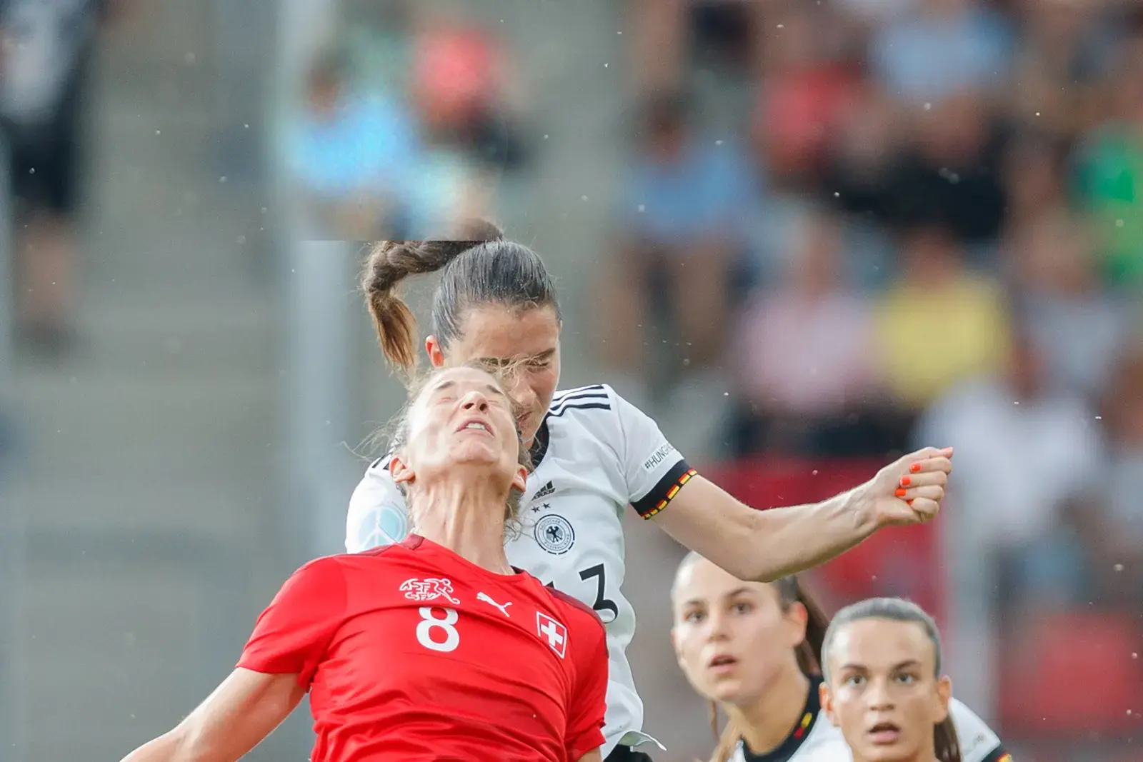 A crowded goalmouth, the ball removed
